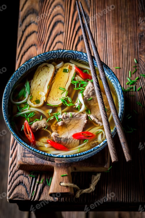 Preview: Closeup of delicious Red Curry soup with beef and noodle