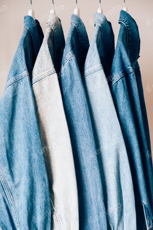 Preview: Denim Jackets Hanging Together on White Hangers