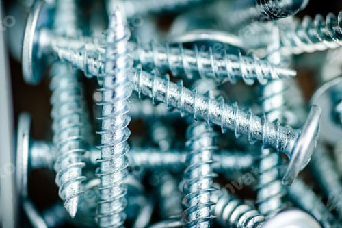Preview: A pile of bolts. Macro background.