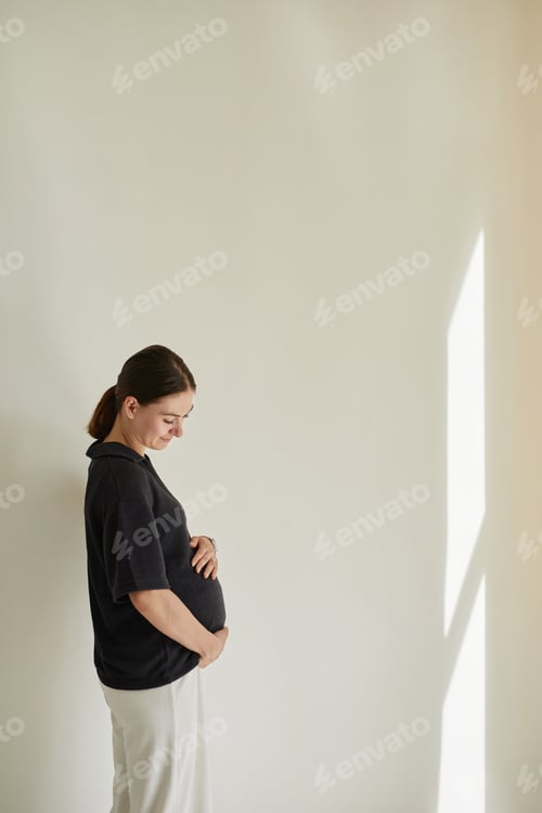 Preview: Pregnant Woman Embracing Belly