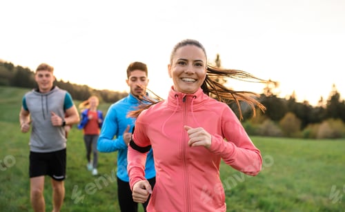Preview: A large group of people cross country running in nature