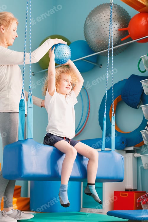 Preview: Boy exercising with ball