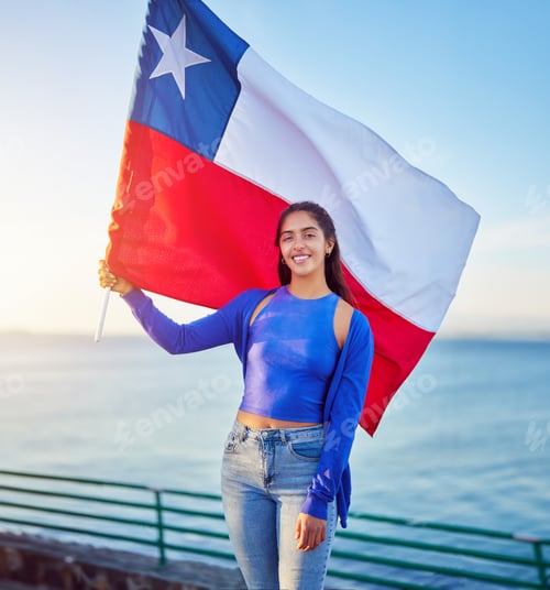 Preview: latin woman holding a flag of chile outdoors