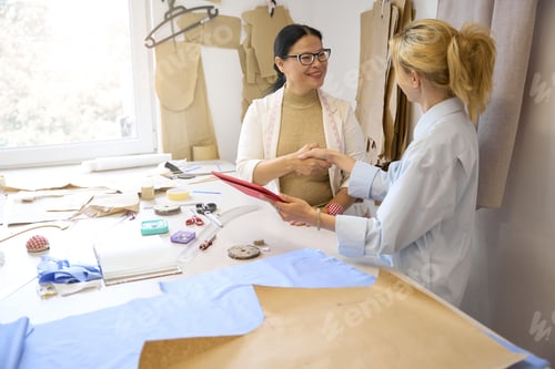 Preview: Ladies fashion designers greet each other at the workplace