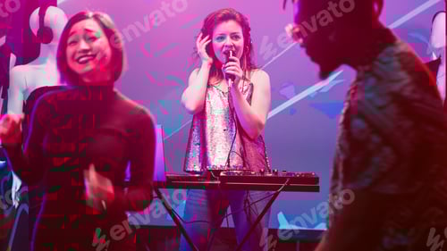 Preview: Cool woman mixing sounds at DJ station