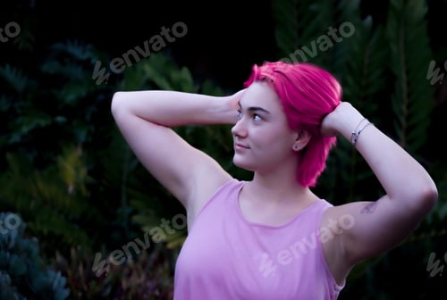 Preview: A teenager showing her support for breast cancer awareness month. Pink and proud