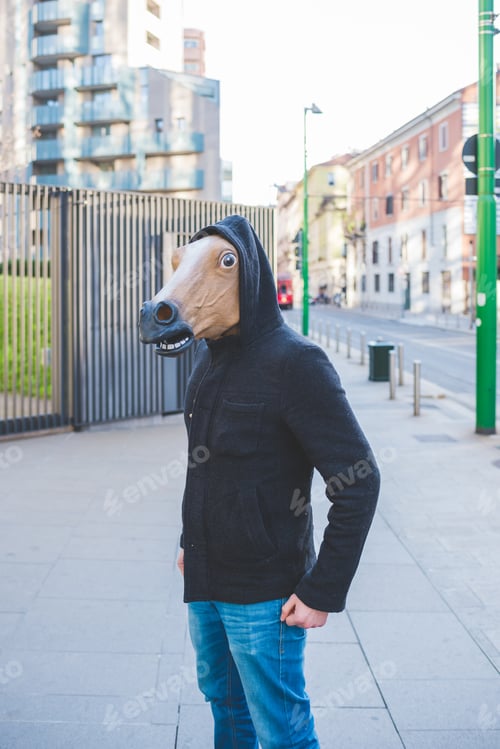 Preview: Young man wearing horse mask
