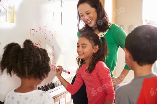 Preview: Pupil writing on the board at elementary school maths class
