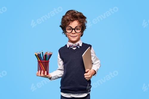 Preview: Clever schoolboy with stationery