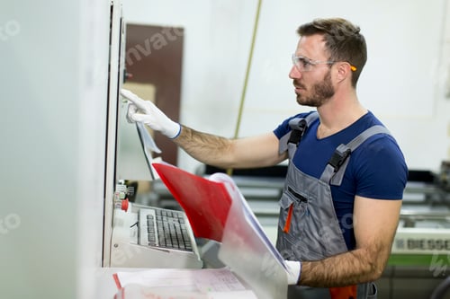 Preview: Young man works in factory