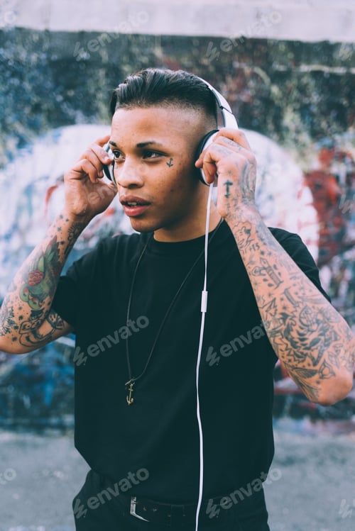Preview: young man outdoor listening music