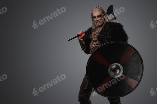 Preview: Aggressive scandinavian barbarian from past with shield and axe