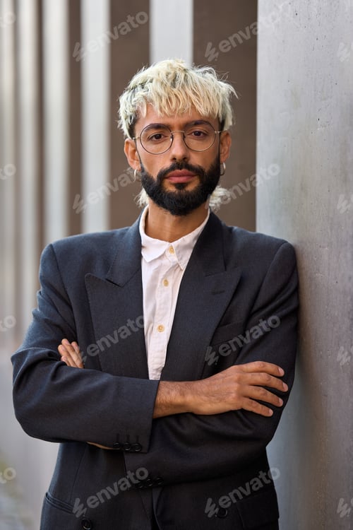 Preview: Modern businessman standing with arms crossed and serious look
