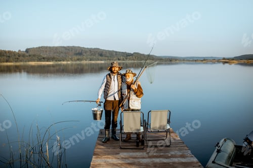 Preview: Grandfather with adult son fishing on the lake