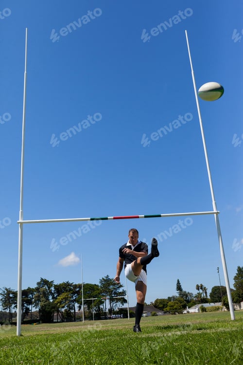 Preview: Rugby player kicking ball through goal post