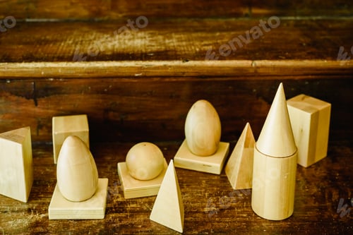 Preview: Solid wood shapes to study geometry and volumes, cones, triangles.