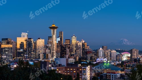 Preview: Stunning aerial view of Seattle, Washington, captures the vibrant cityscape illuminated by lights