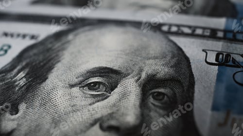 Preview: Close-up of Benjamin Franklin's eyes on a hundred dollar bill