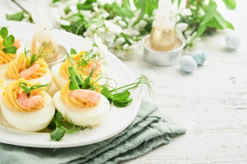 Preview: Stuffed or deviled eggs yolk, shrimp, pea microgreens with paprika for easter table decorate fresh c