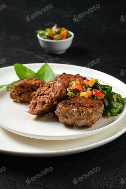 Preview: Closeup view of fried frozen veal meatballs on a plate