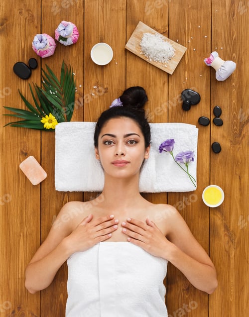 Preview: Relax At Spa. Portrait Of Woman Patient In Ayurveda Wellness Center Lies On Wood With Aroma Spa