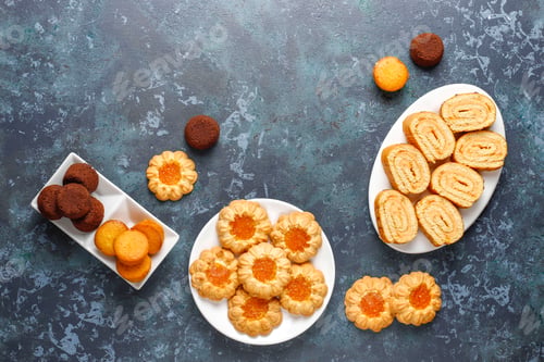 Preview: Mix of sweet cookies,cake roll,mini cupcakes.
