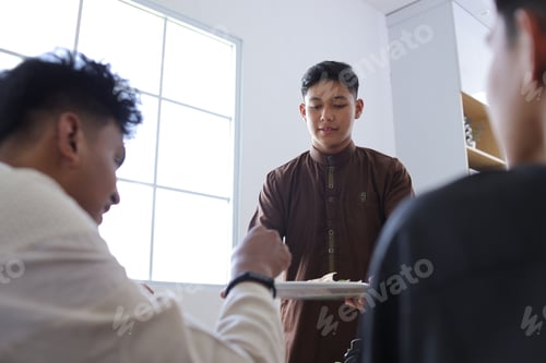 Preview: Humble Young Asian Muslim Man Served a Tray of Food For His Friends To Break Fasting