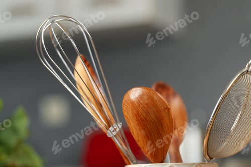 Preview: Kitchenware utensils in a cup on kitchen table
