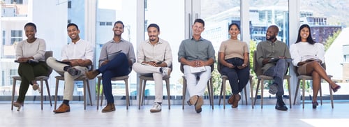Preview: Future leaders. Shot of a group of people waiting to be interviewed for a job at a modern office.