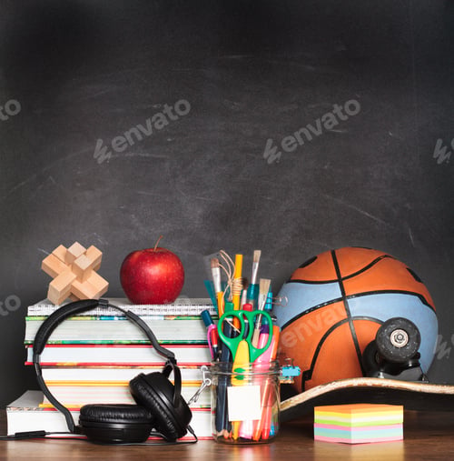 Preview: Back to school. Books, pencils, accessories, ball on desktop. School, study concept. Learning, sport