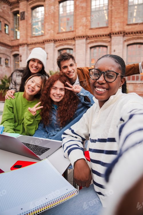 Preview: Vertical. African american teenage student taking a selfie with her friends using a smart phone