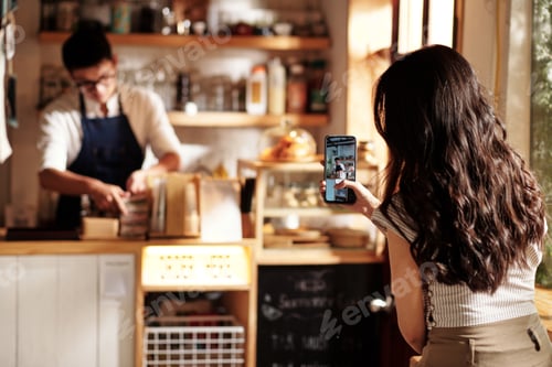 Preview: Woman Filming Coffeeshop Worker
