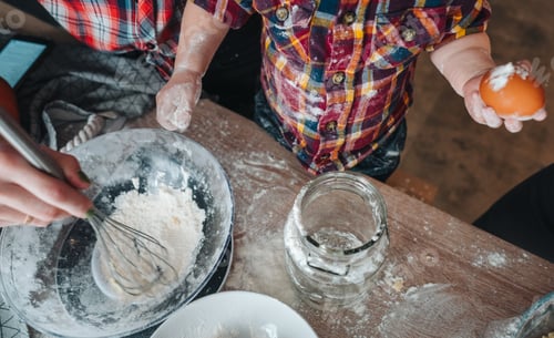 Preview: Little son helps in the kitchen to dad and mom