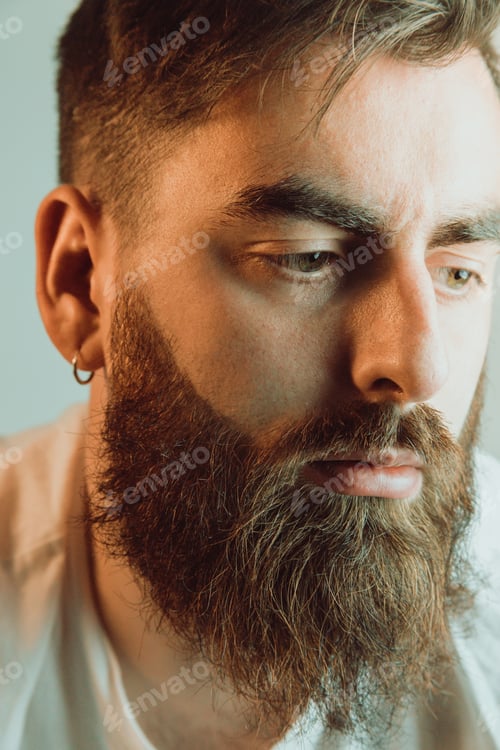 Preview: Portrait of a handsome bearded man, hipster style, serious, colorful, beauty