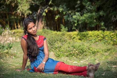 Preview: Outdoor portrait of beautiful young Indian girl in the park