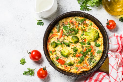Preview: Frittata with vegetables on white stone table