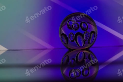 Preview: Transparent sphere isolated on a blue and pink background
