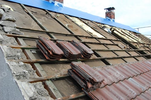 Preview: tiles being removed from a roof