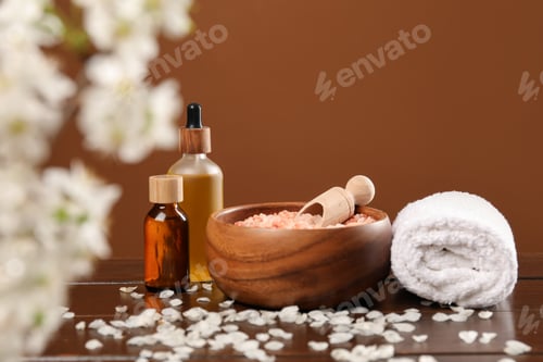 Preview: Spa composition with cosmetic products and beautiful flowers on wooden table
