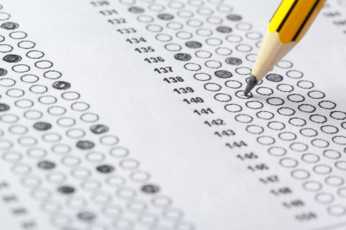 Preview: Students practice test answers during a short exam in a classroom setting