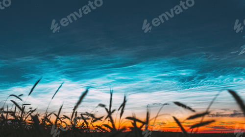Preview: 4K Night Starry Sky With Glowing Stars Above Countryside Landscape. Noctilucent Clouds Above Rural
