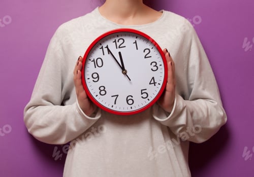 Preview: Woman holding clock