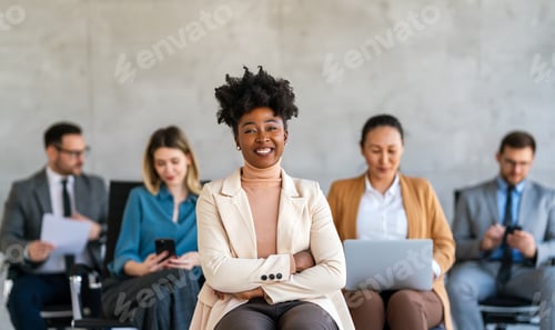 Preview: Smiling Woman in Beige Blazer in Office Waiting Room