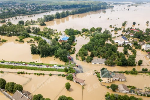 Preview: Aerial view of flooded houses with dirty water of Dnister river in Halych town, western Ukraine.