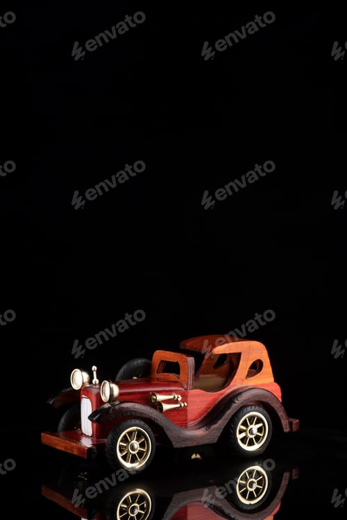 Preview: Vintage collectible automobile isolated on black background. Miniature of auto model. Copy space