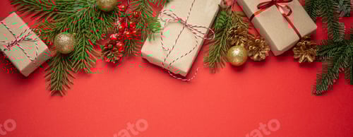 Preview: Wrapped Christmas Gifts with Evergreen Branches on Red