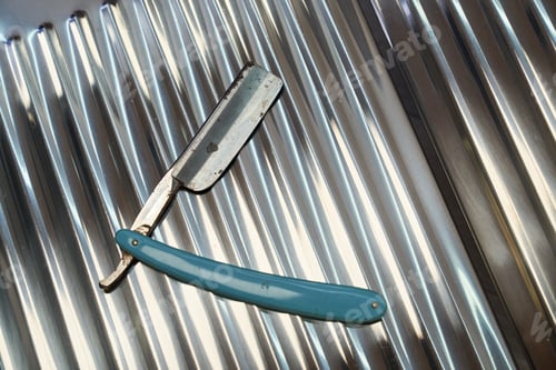 Preview: Vintage dangerous razor for haircuts on metal background