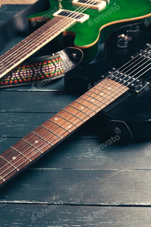 Preview: Electric guitar body and neck detail on wooden background