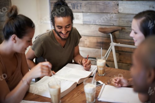 Preview: Cropped shot a group of friends studying together at a coffee shop