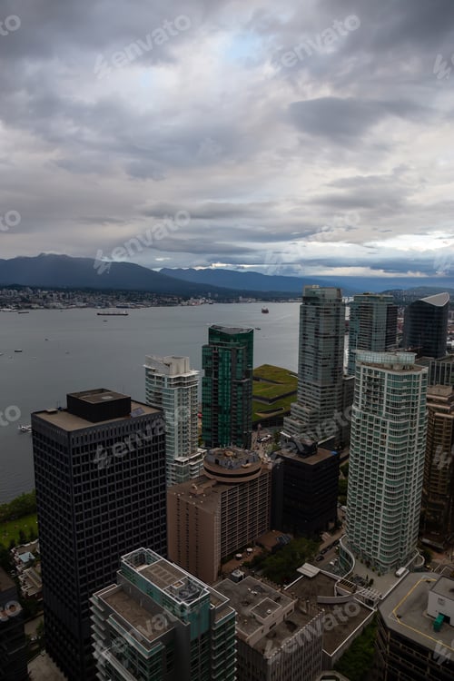 Preview: Aerial view of Downtown City during a stormy summer evening before sunset